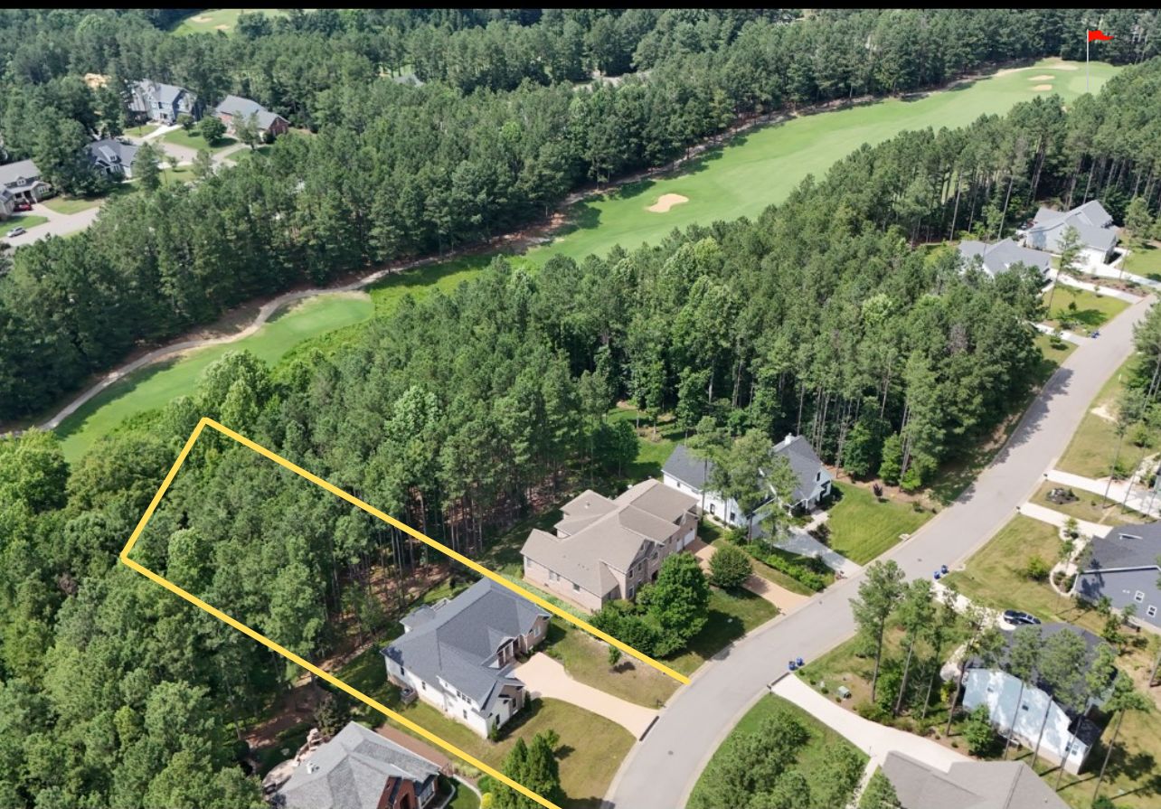 Brandon Pines lot with golf course with flag marker